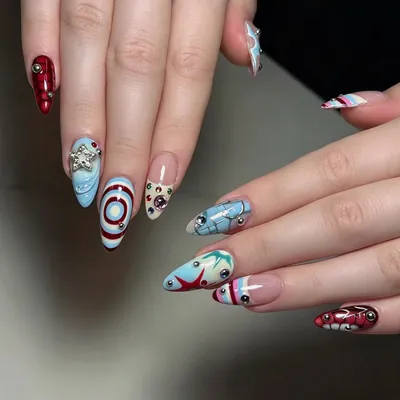 Mixed blue and red hand-painted cartoon and graphic nail art