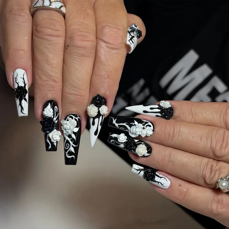 Long black and white nails with sculpted 3D roses